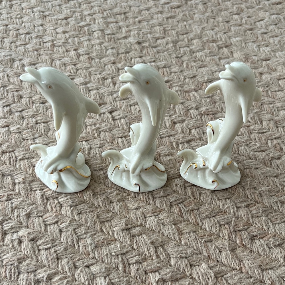 Three Lenox Cream and Gold Dolphin Sculptures